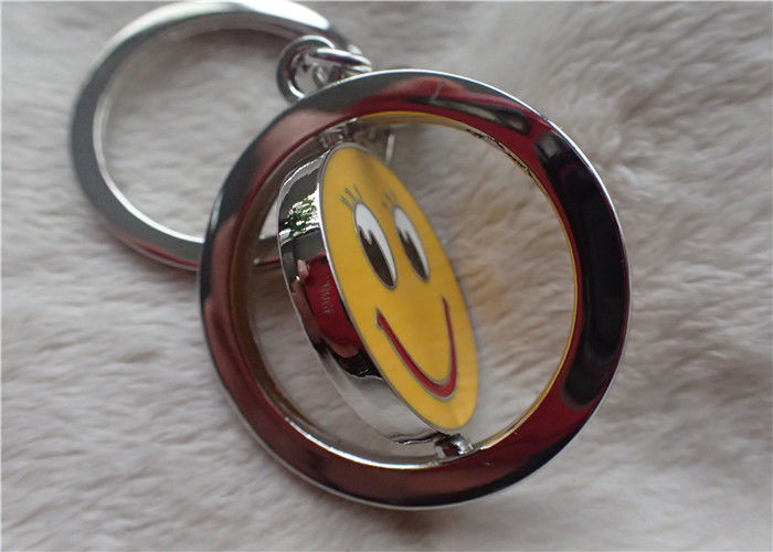 Color Silver Key Chain Personalized Promotional Gifts With Rotatable Smiling Yellow Face